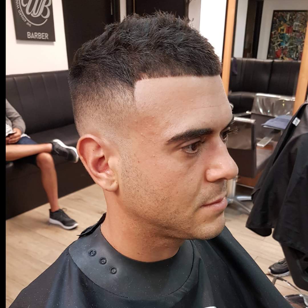 Textured crop with a high skin fade, cut in the shop
