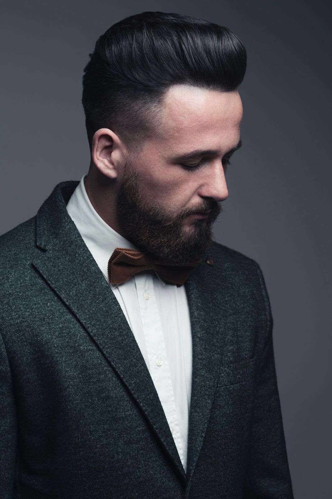 Editorial pompadour with tweed jacket and bow tie